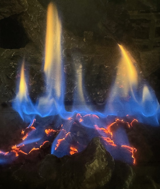 This photo shows the flames from a gas fireplace.